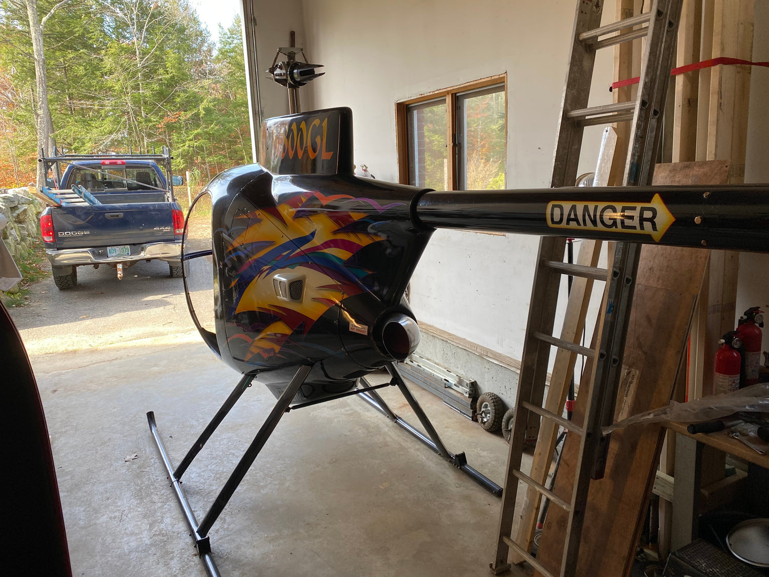 RV garage with a helicopter inside