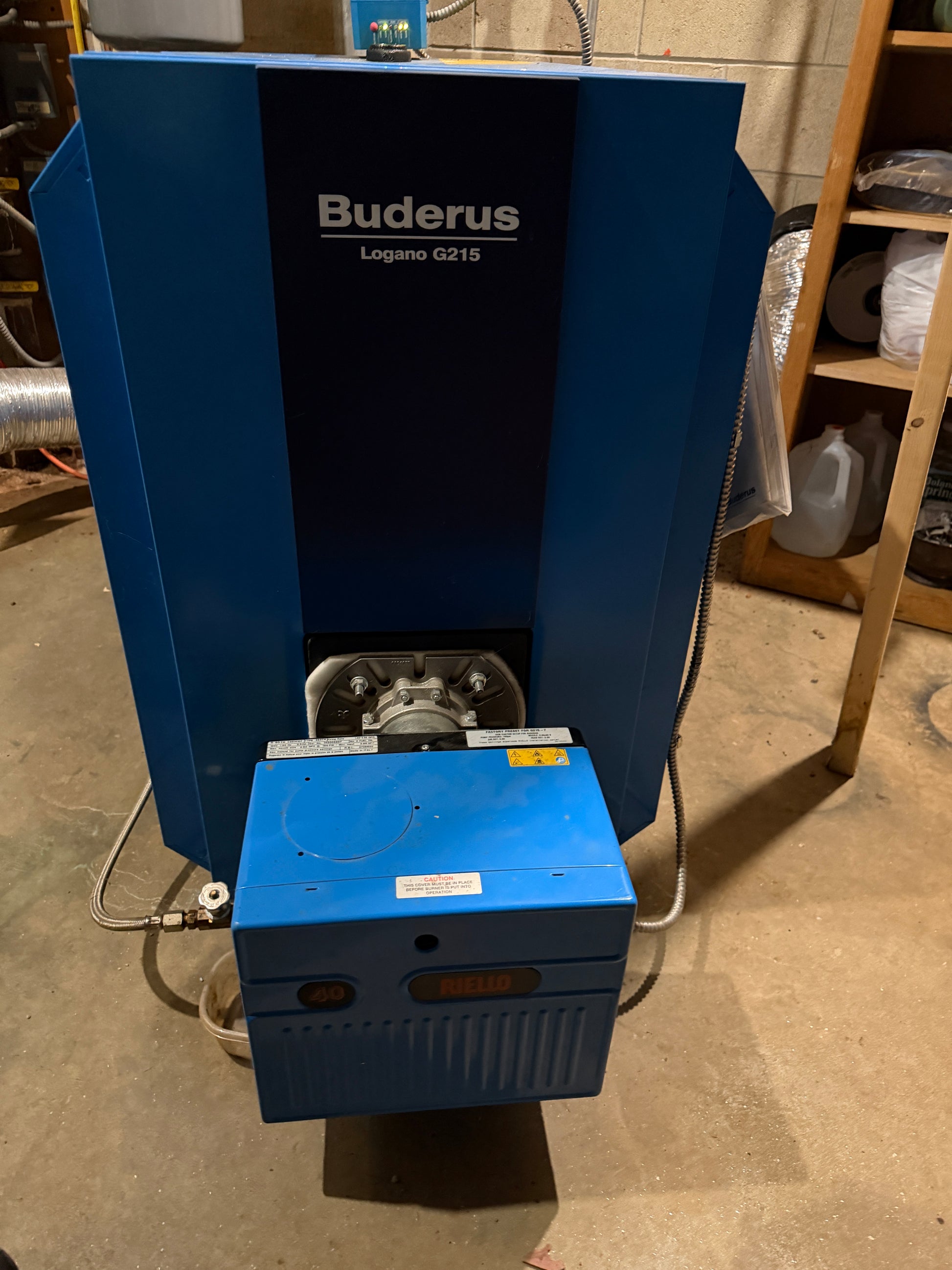 Buderus boiler on a concrete floor with visible branding