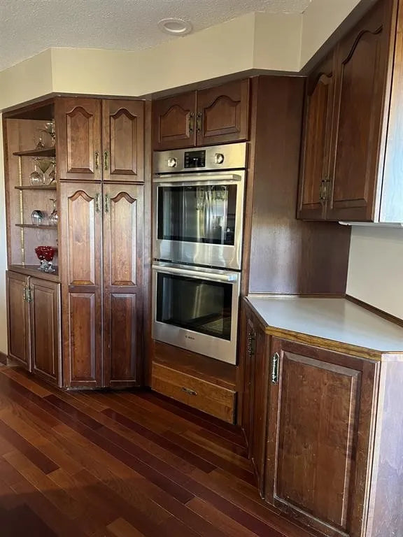 Kitchen with cherry  cabinets and stainless steel appliances