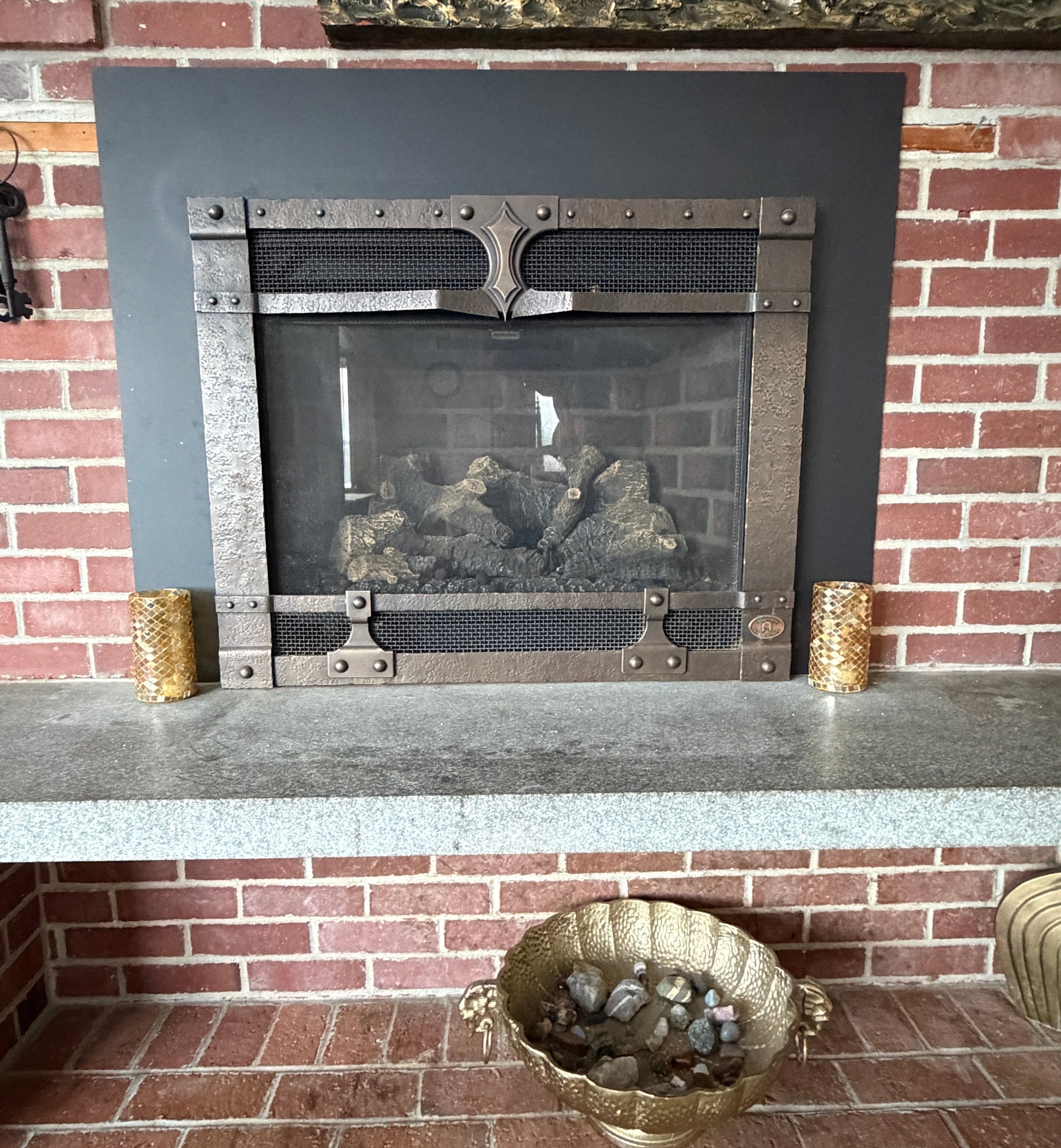 Decorative fireplace with decorative elements on a brick wall