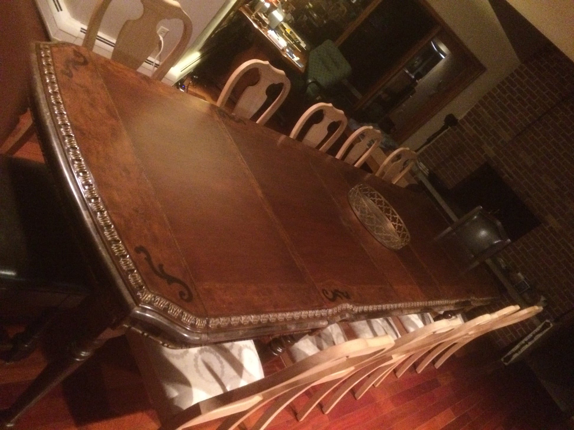 Dining table with  fireplace chairs in a dining room setting