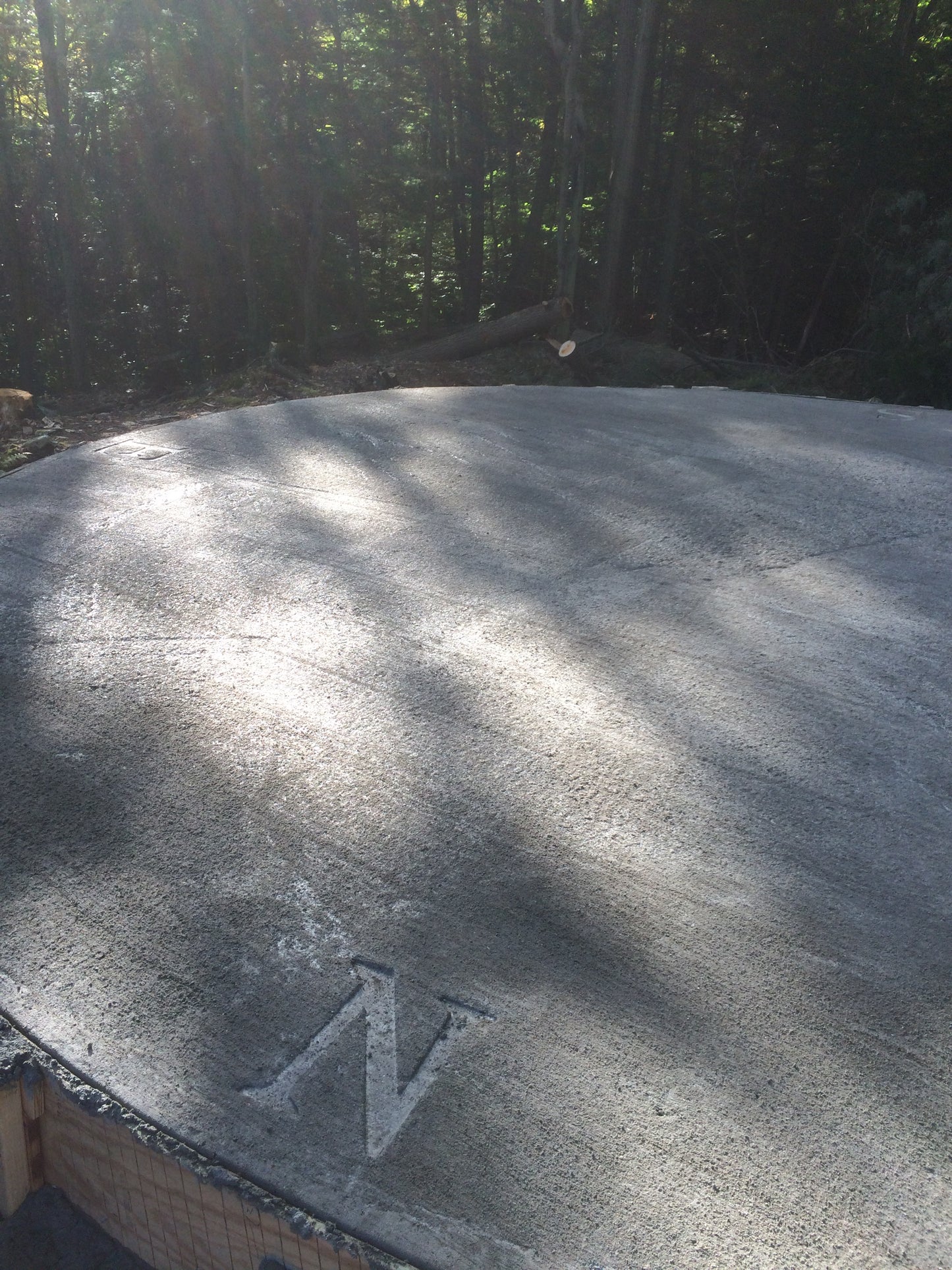 Close-up of a textured surface with a letter 'N' on a dark background