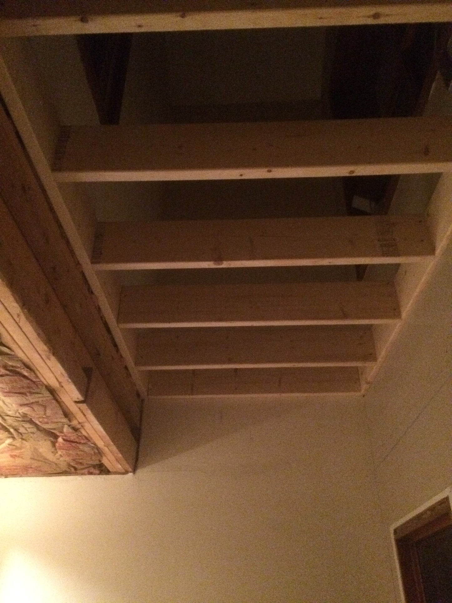 under construction against a wall in a dimly lit room