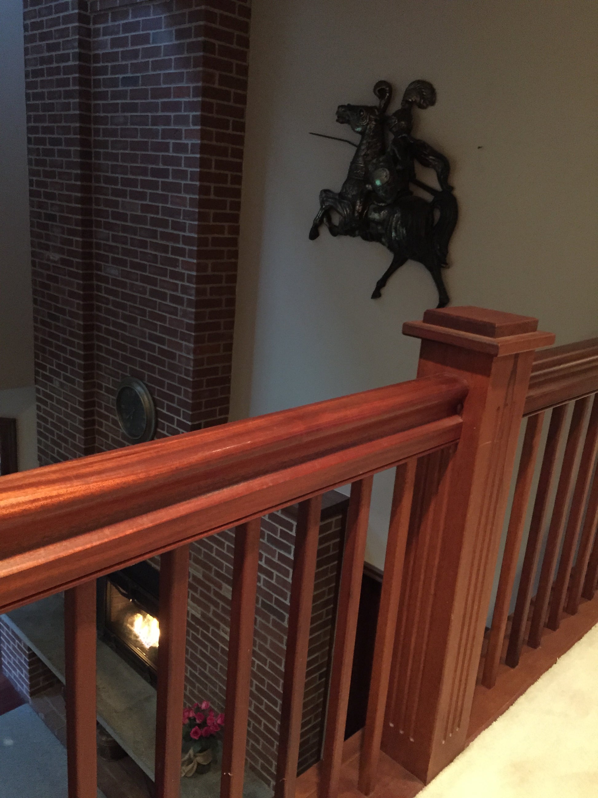 Wooden staircase with a knight and a joust . Old fire place view before construction