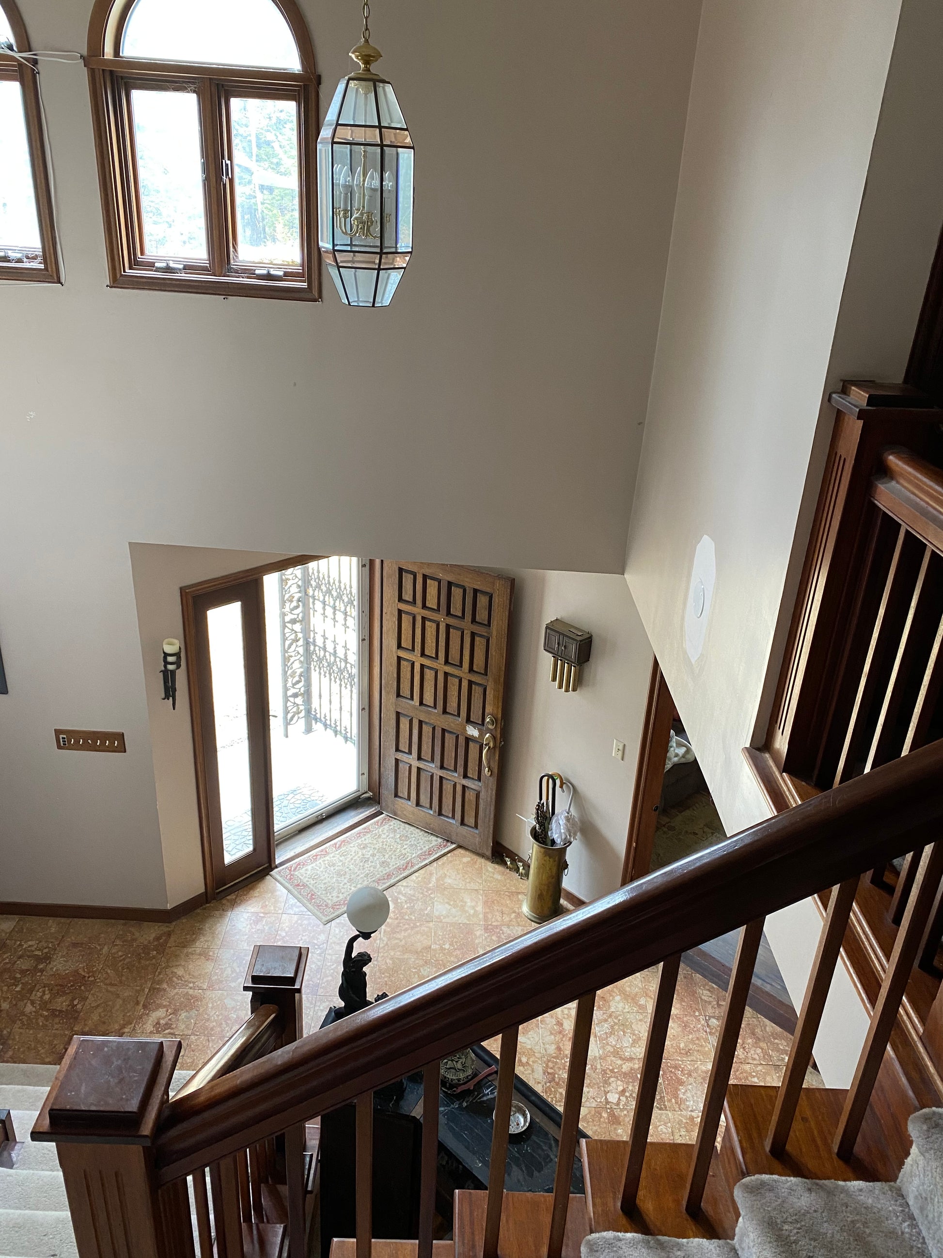 Staircase with wooden  mahogany railings in a home interior