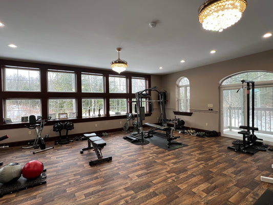 Gym luxury room  with various exercise equipment on a wooden floor. Fitness studio