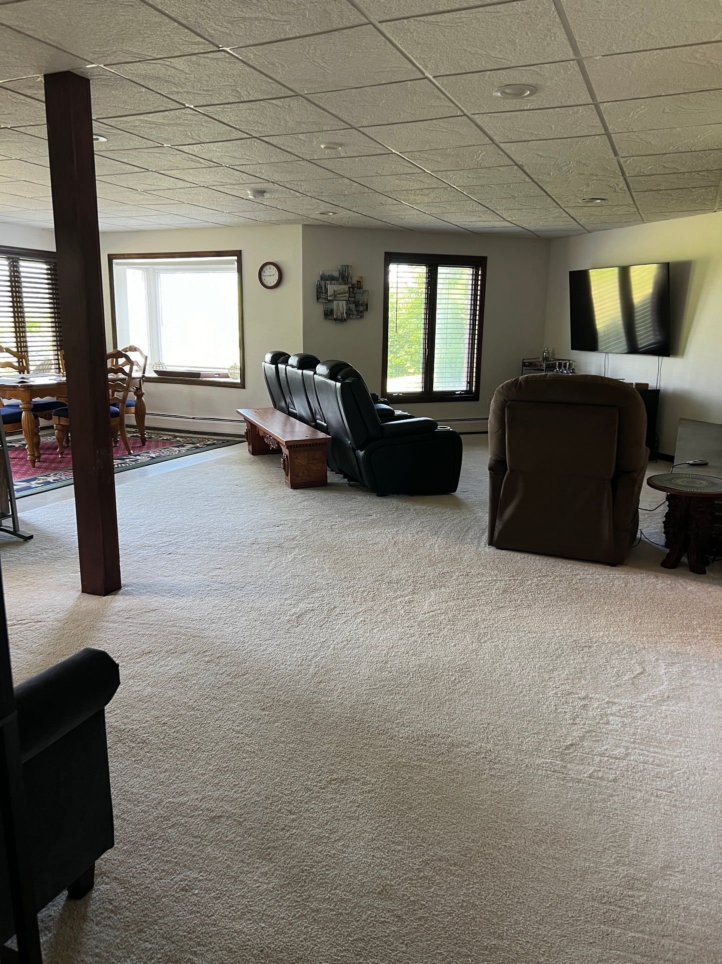 Living room with a couch, chair, and coffee table in a home setting.