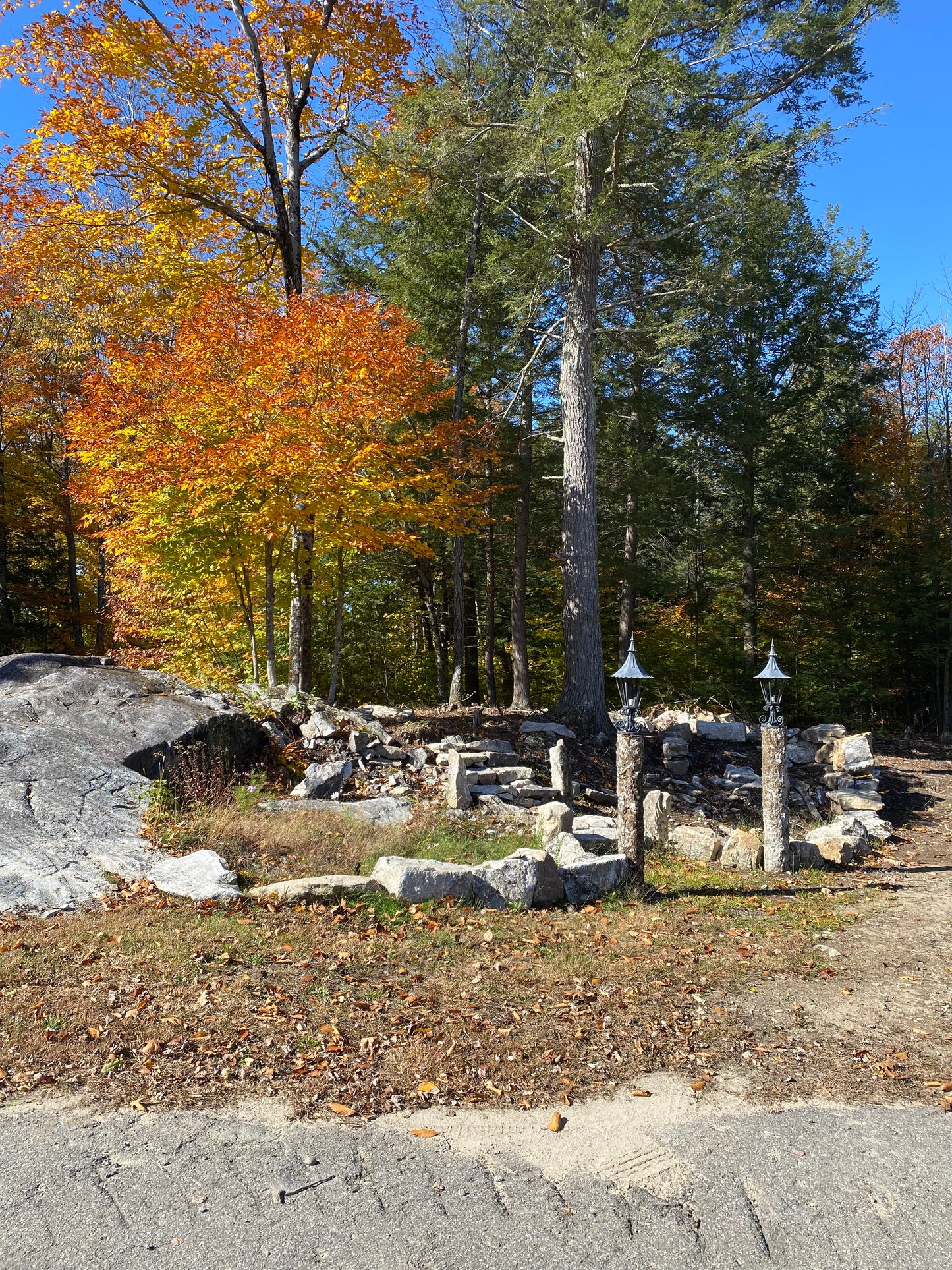 Abandoned stone building with autumn trees in the background