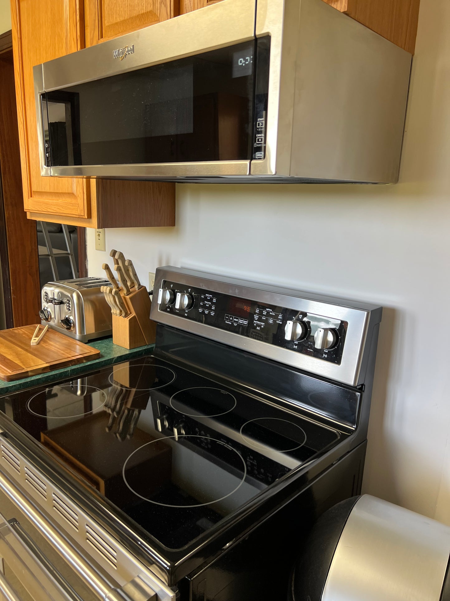 Stainless steel oven with microwave above in a kitchen setting