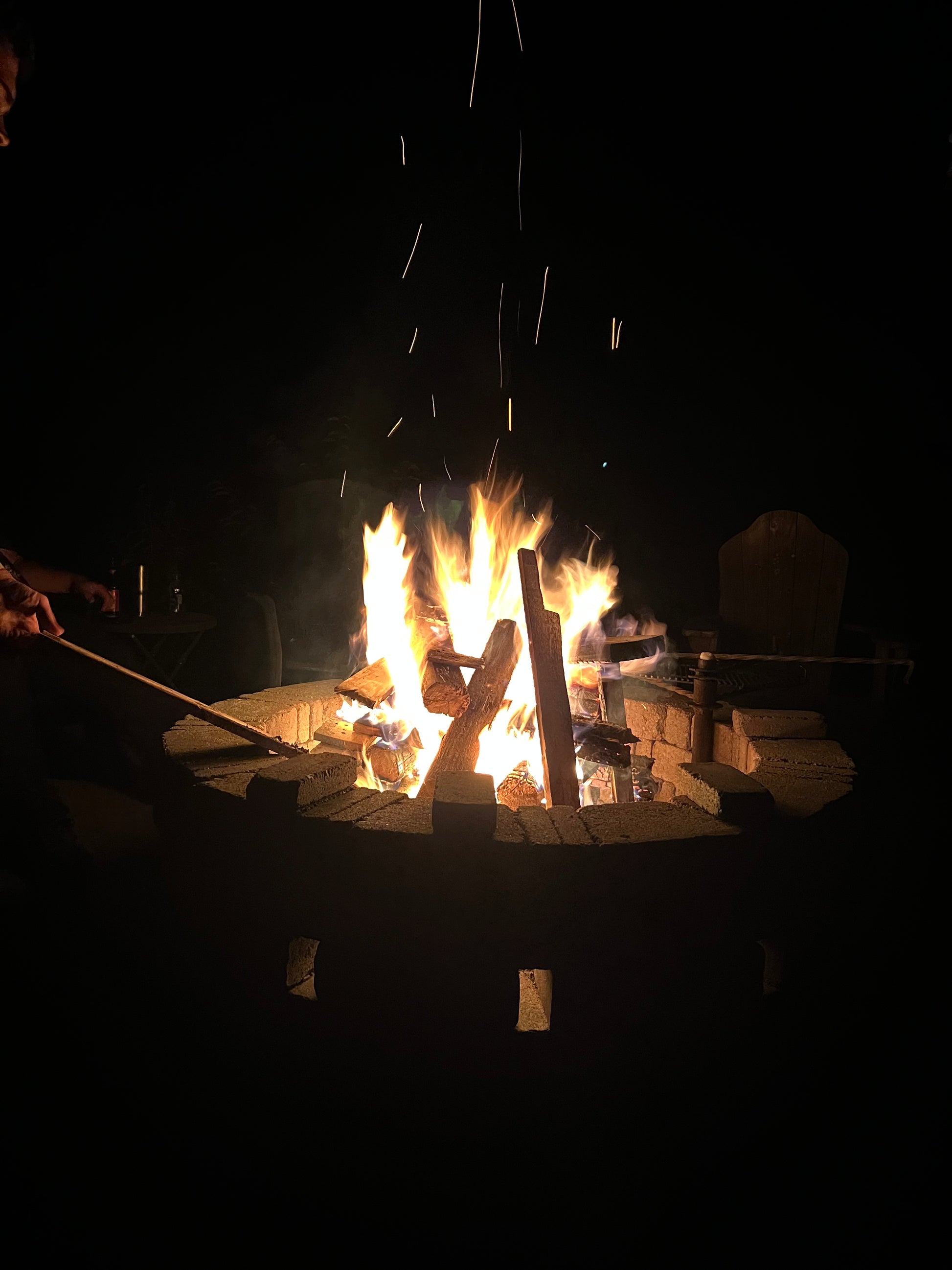 Fire pit with flames at night