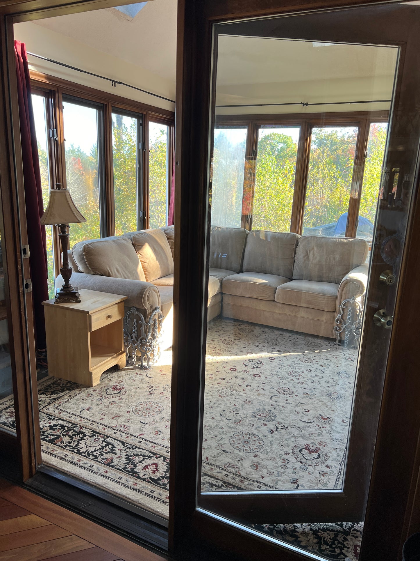 Top-down view of a living room with a sofa and rug, 