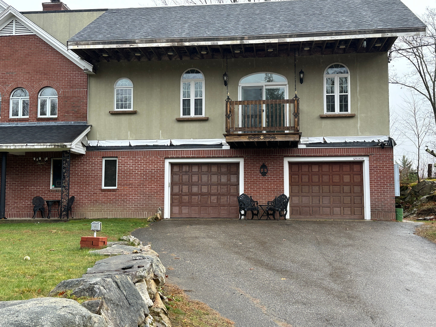Deck on  house with a garage and driveway