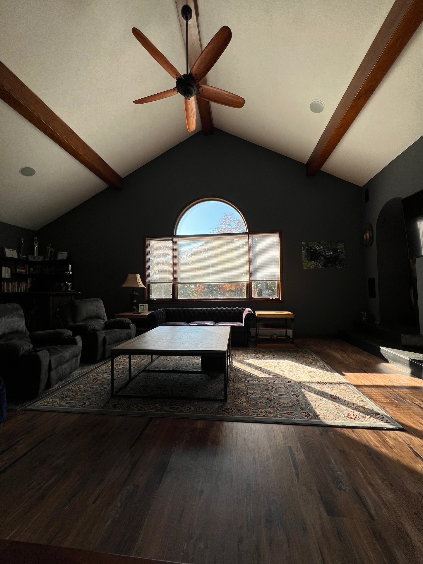 Top-down view of a room with a ceiling fan, window, and furniture.