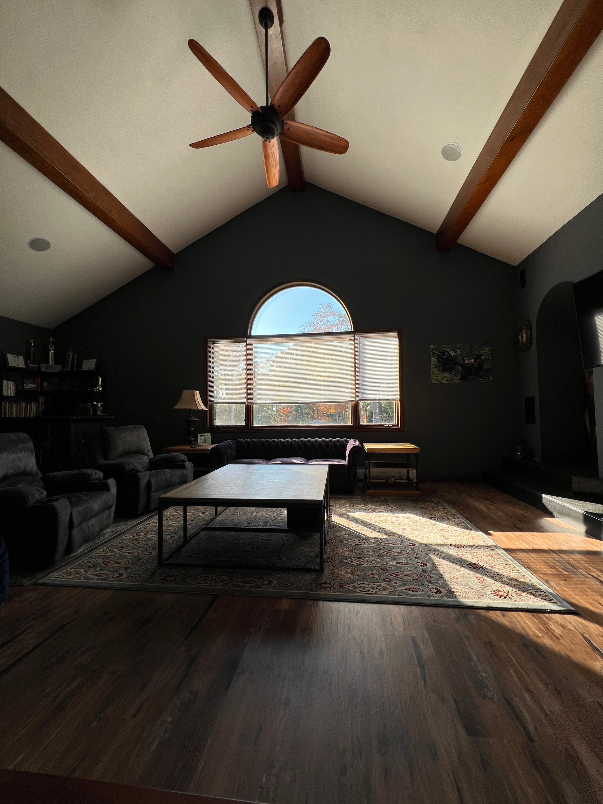 Top-down view of a room with a ceiling fan, window, and furniture.