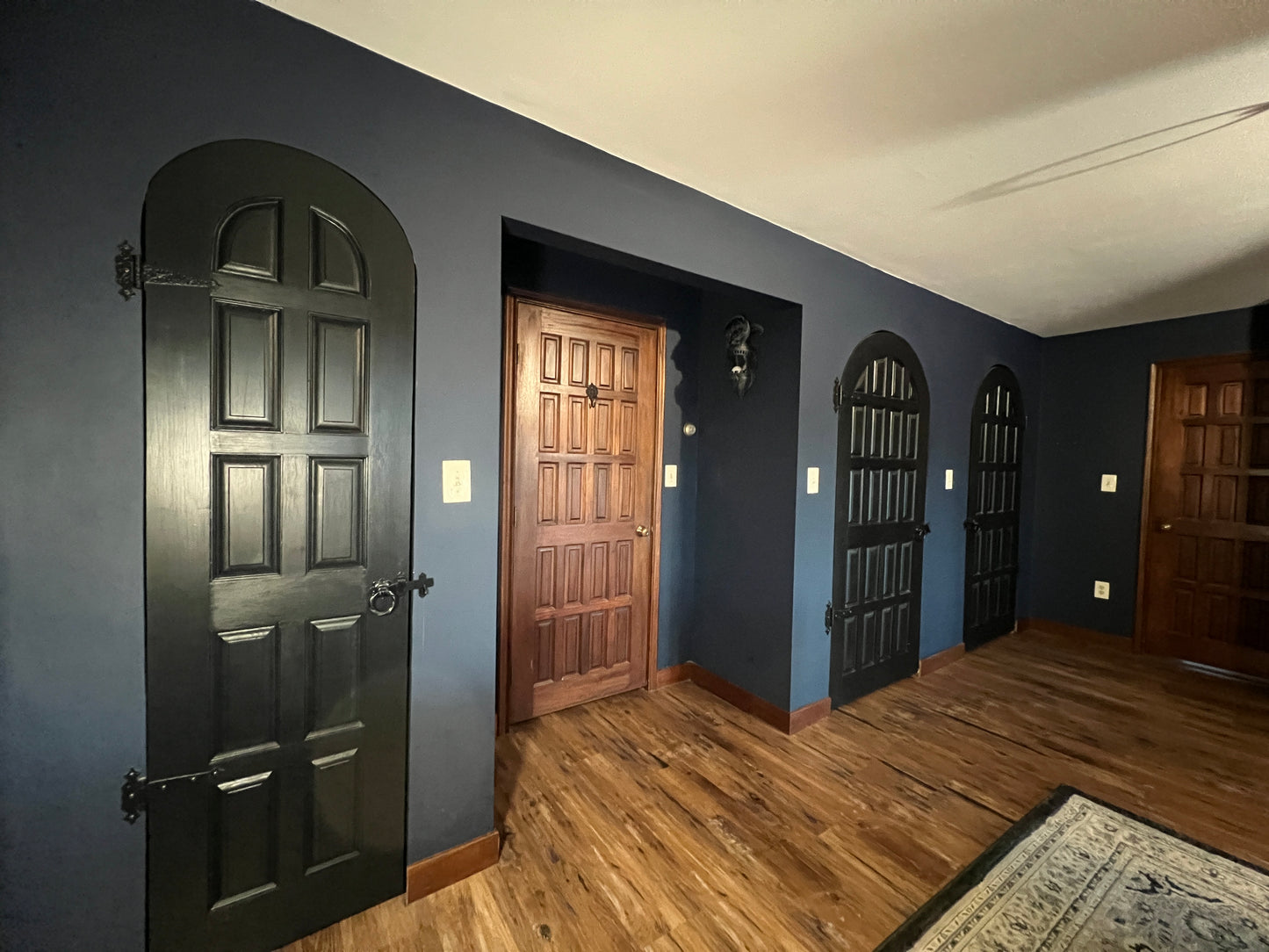 Master Bedroom with 4 closets Custom made doors Some mahogany with castle style hinges and hardware