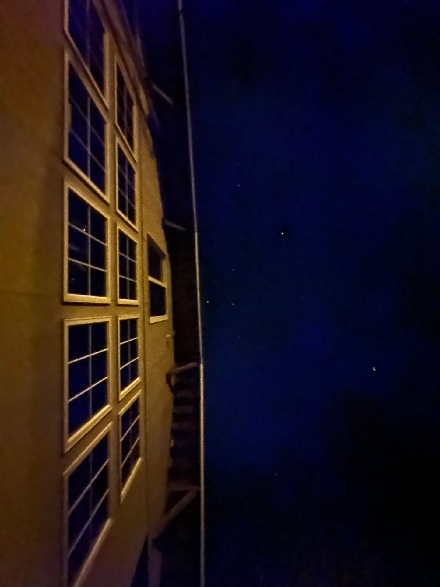 Library with windows at night under a dark sky