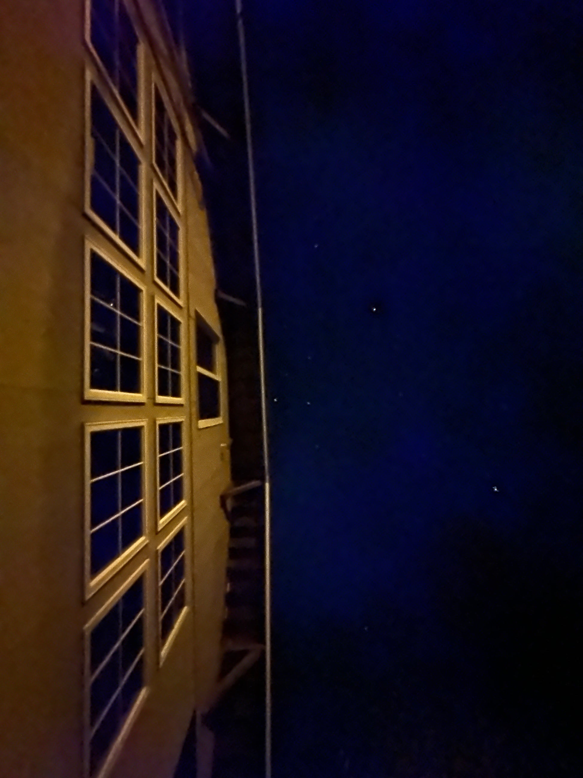 Library with windows at night under a dark sky