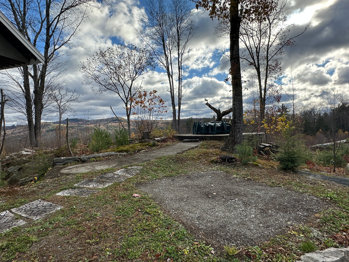 Scenic view from a elevated position with trees and a cloudy sky at the fire pit Nature View NH Estate
