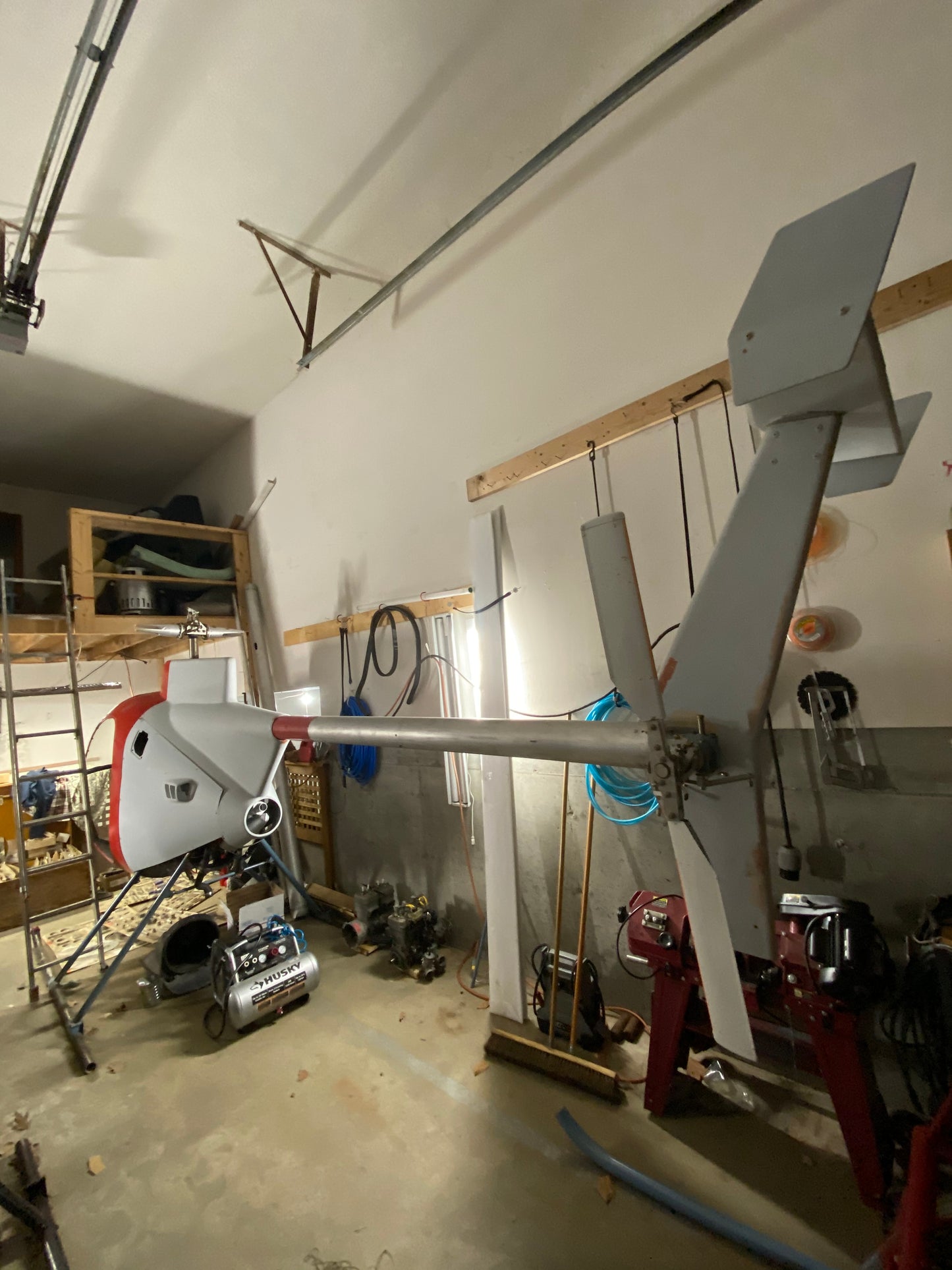 Ceiling-mounted mechanical device in a workshop setting