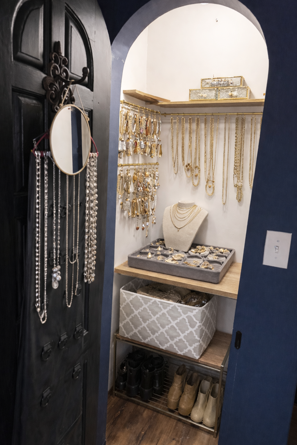 Jewelry closet display your jewels interior with hanging necklaces and display cases.