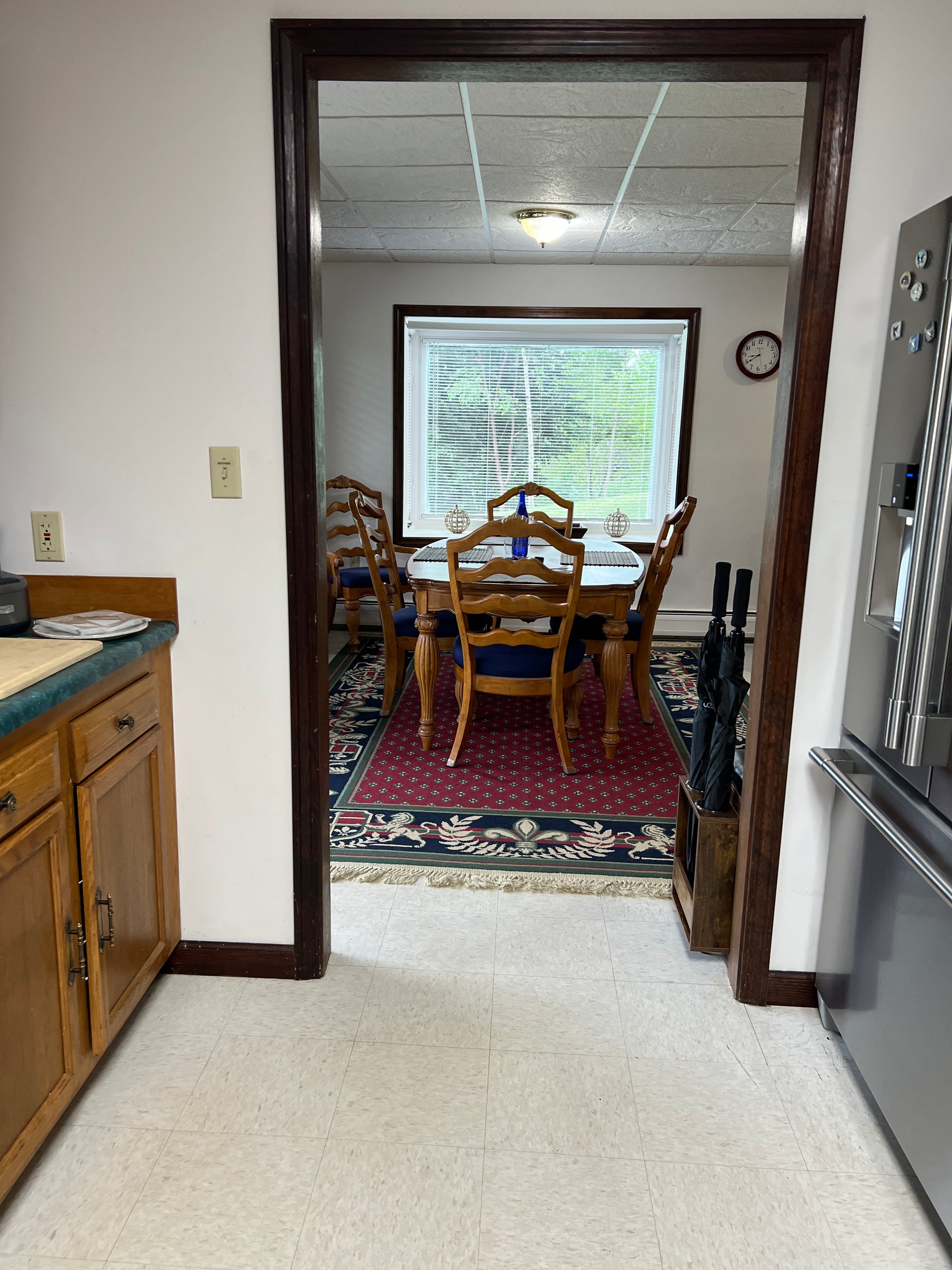 Dining area  a large window and chairs.