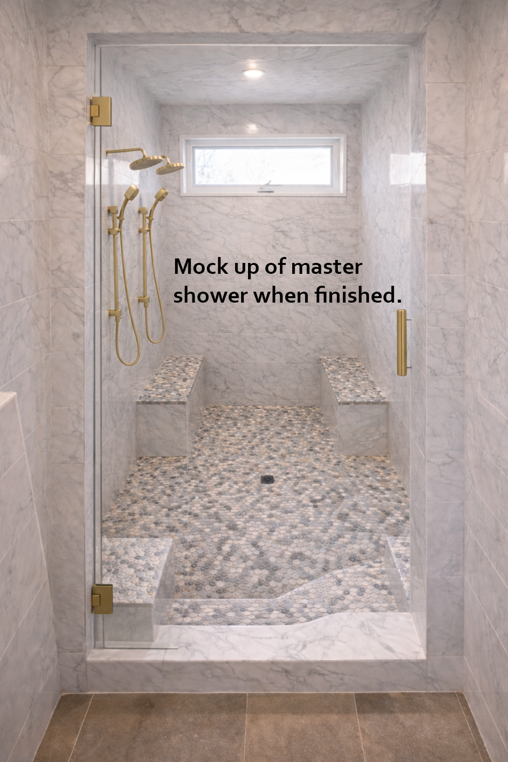 Mock-up of a master shower with marble walls and floor, gold fixtures, and a window.