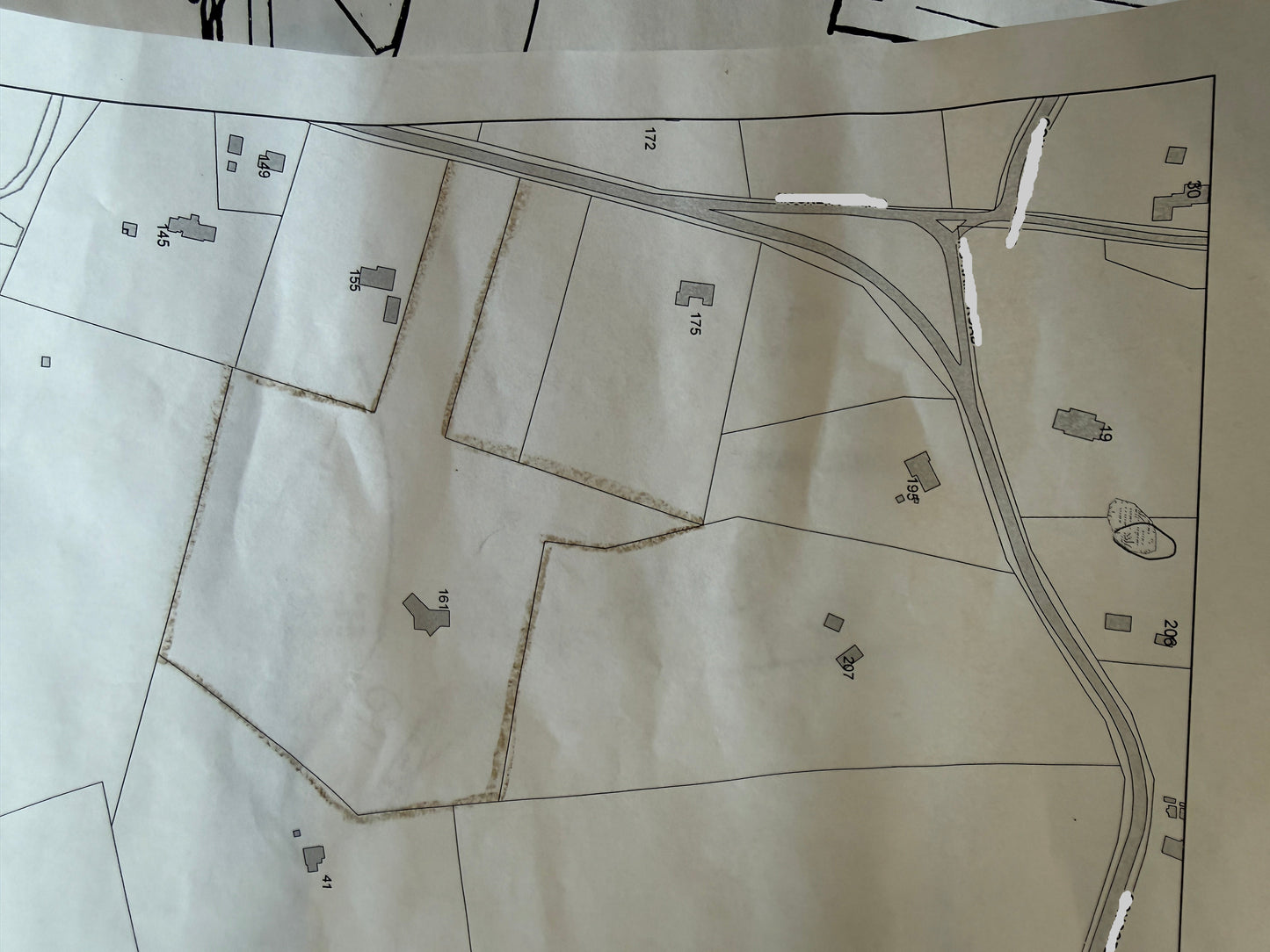 Map of a rural area with roads and property lines.