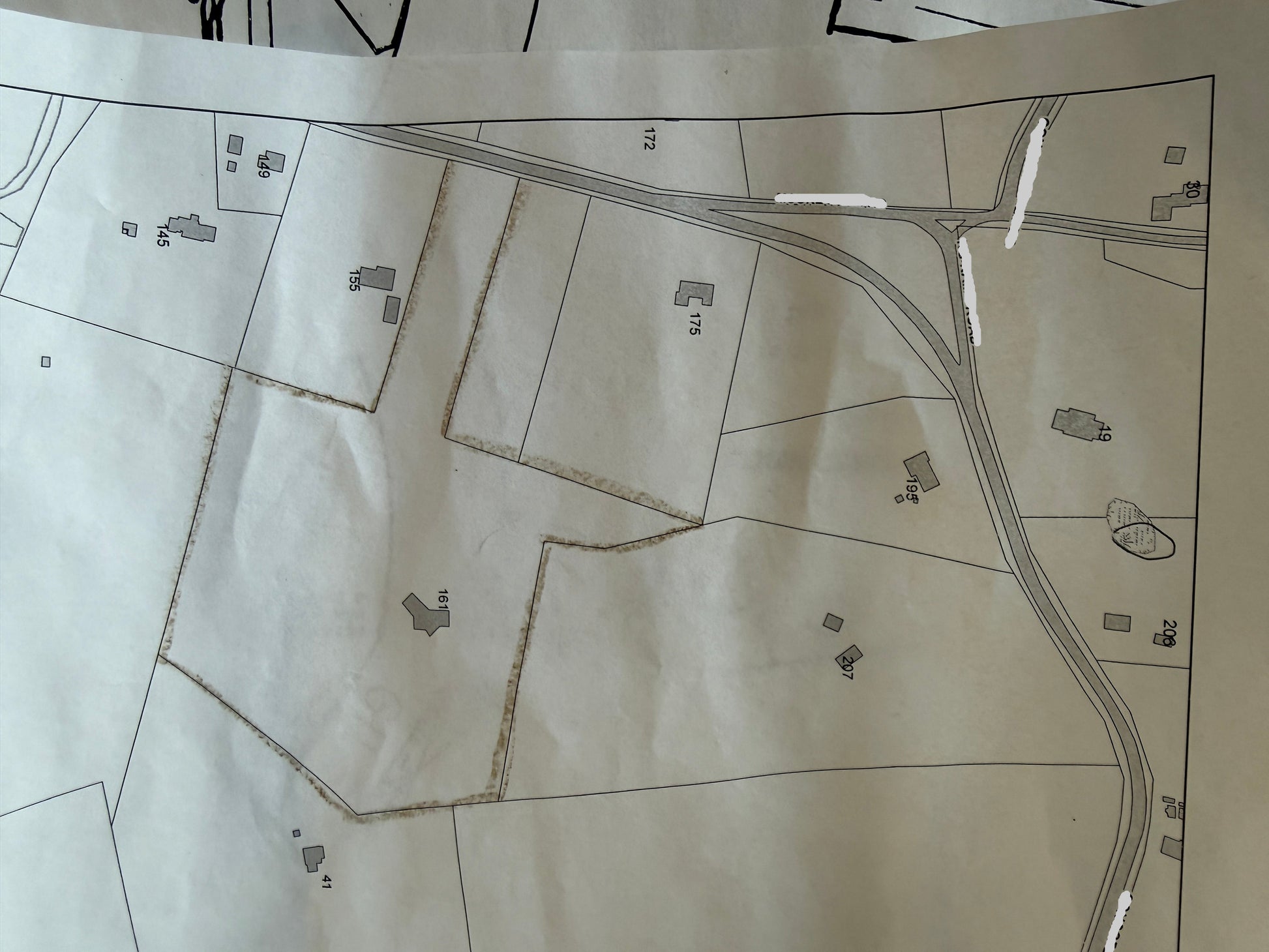 Map of a rural area with roads and property lines.