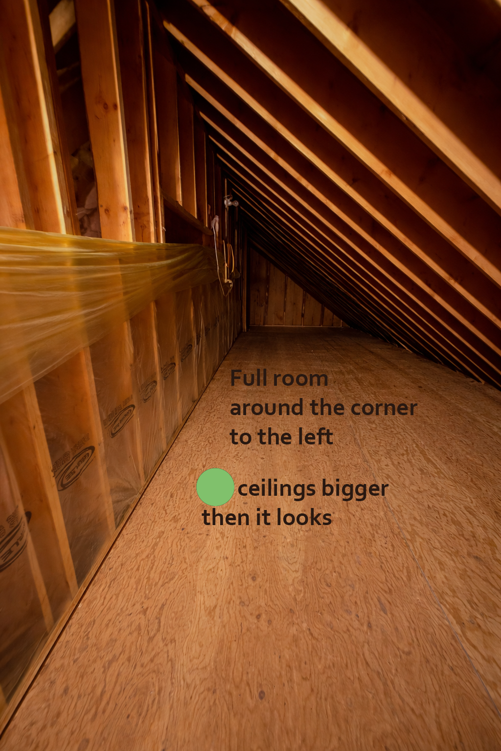 Attic space with wooden beams and floorboards, text indicating room dimensions.