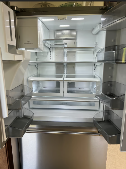 Empty refrigerator with all shelves removed
